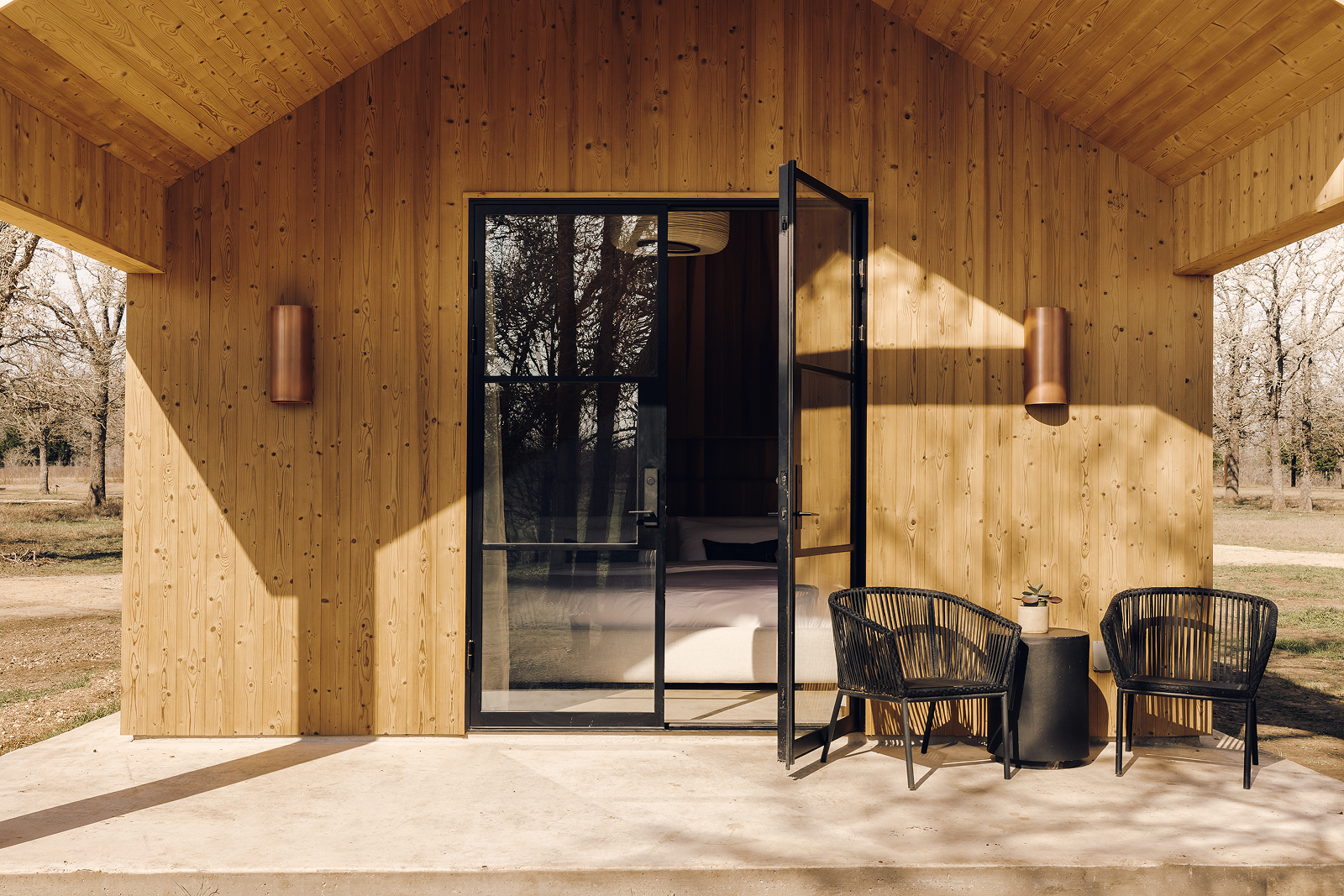 Luxury Post Oak Cabin exterior with patio seating